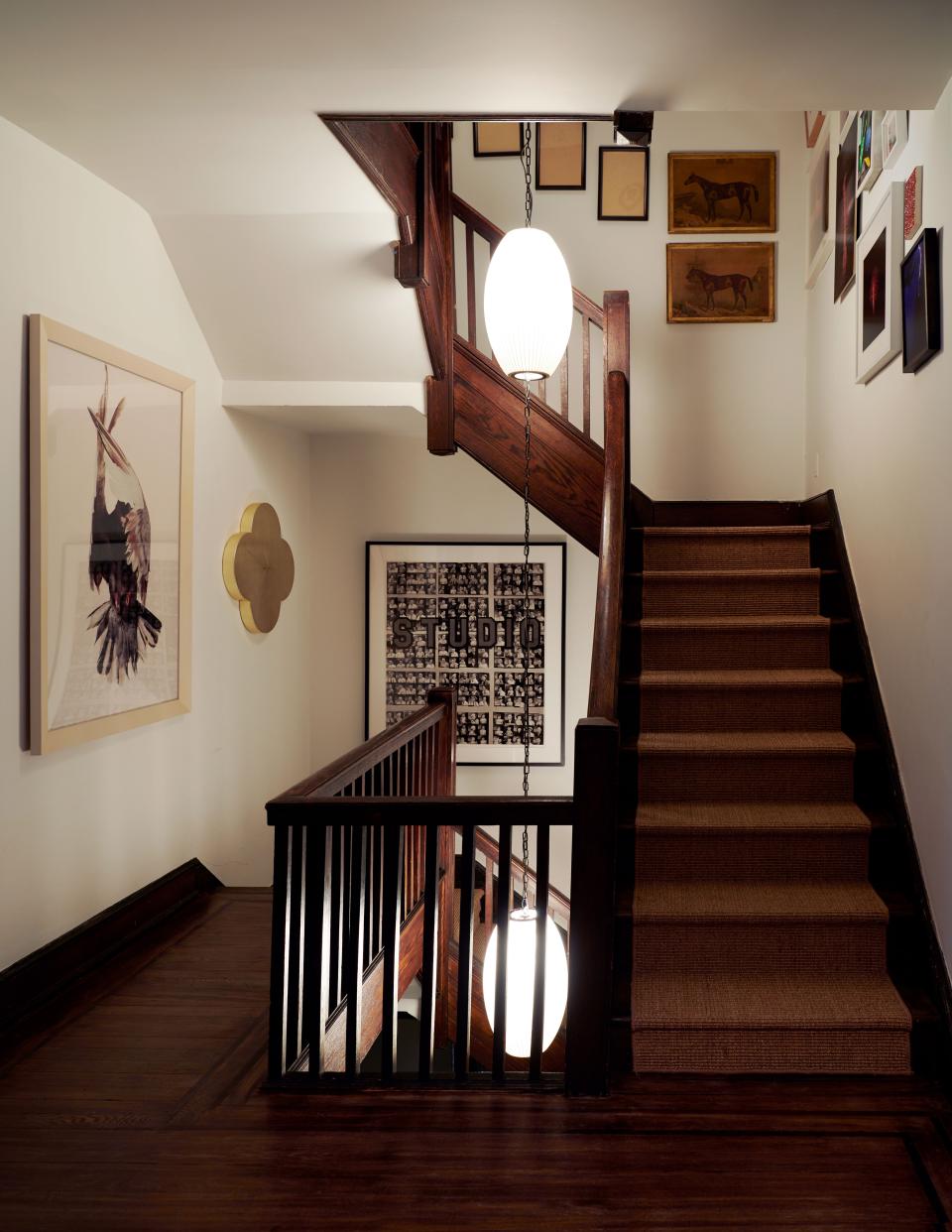 George Nelson lights hang in the stairwell, which displays photographs by Walker Evans and <a href="https://gagosian.com/artists/roe-ethridge/">Roe Ethridge</a> and a painting by <a href="http://www.maxgimblett.com/">Max Gimblett</a>.