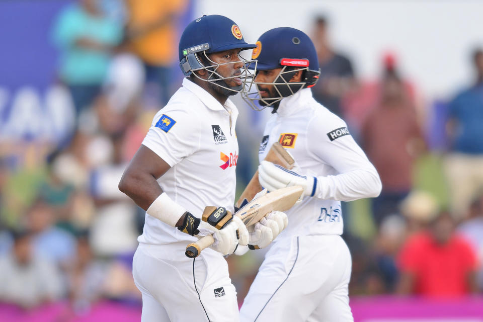 Sri Lanka's captain Dhananjaya de Silva, right, and teammate Angelo Mathews run between the wickets on the third day of the first cricket test match between New Zealand and Sri Lanka in Galle, Sri Lanka, Friday, Sept. 20, 2024. (AP Photo/Viraj Kothalawala)