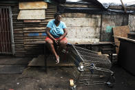 <p>A girl suffering from obesity sits in front of her house in the Langa township, a poor suburb of Cape Town. Obesity in South Africa affects more women than men: 69.3 per cent of South African women have unhealthy levels of body fat and more than four in 10 are clinically obese. (Photograph by Silvia Landi) </p>