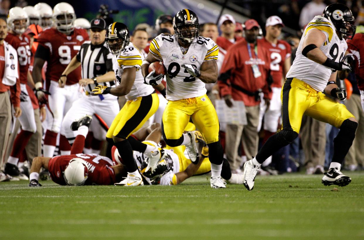 Steelers linebacker James Harrison returns an interception 100 yards for a touchdown in the second quarter against the Cardinals during Super Bowl 43, Feb. 1, 2009, in Tampa. [The Associated Press/File]