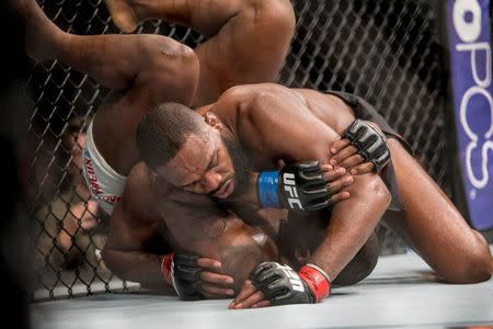 Apr 23, 2016; Las Vegas, NV, USA; Jon Jones (red gloves) competes against Ovince Saint Preux (blue gloves) during UFC 197 at MGM Grand Garden Arena. Mandatory Credit: Joshua Dahl-USA TODAY Sports