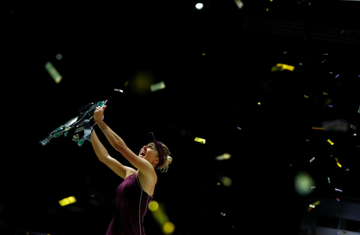 Elina Svitolina celebrates with the Billie Jean King Trophy after winning the singles final against Sloane Stephens at the WTA Finals Singapore on 28 October, 2018. (PHOTO: Reuters/Edgar Su)