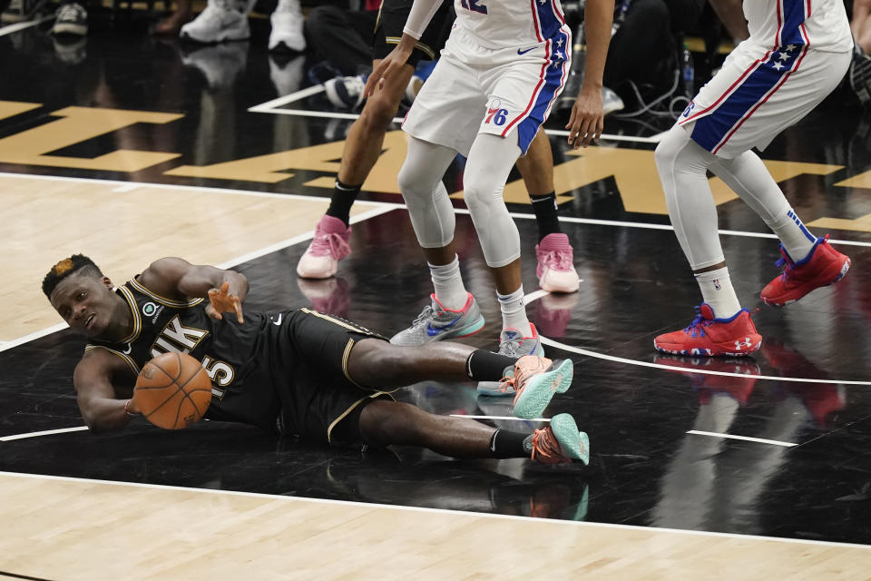 Atlanta Hawks' Clint Capela (15) dives for the ball against the Philadelphia 76ers during the first half of Game 4 of a second-round NBA basketball playoff series on Monday, June 14, 2021, in Atlanta. (AP Photo/Brynn Anderson)