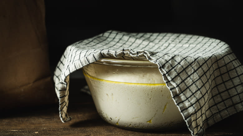 Dough in bowl with towel