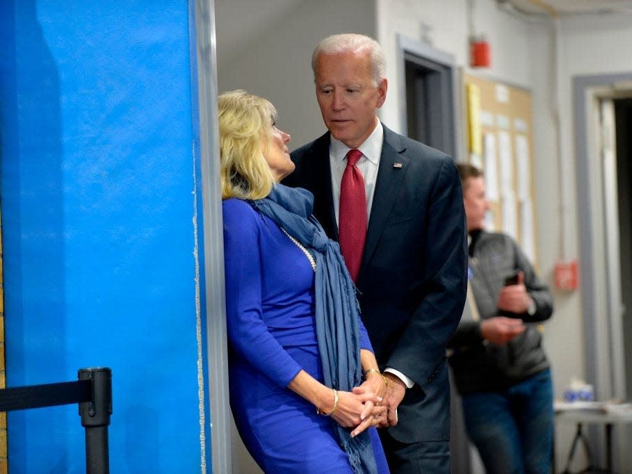 Joe and Jill Biden talk before a town hall in 2019.