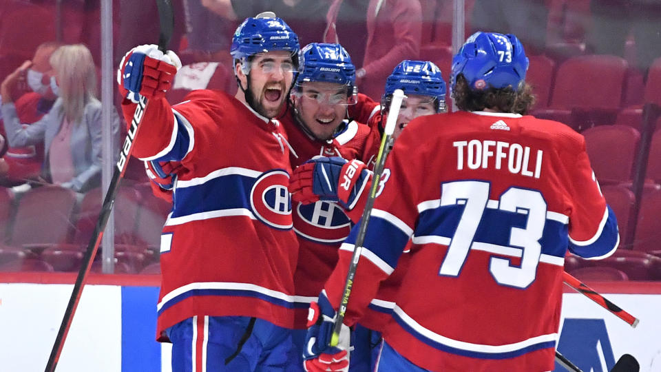 MONTREAL, QC - June 7: Erik Gustafsson #32 and Nick Suzuki #14 of the Montreal Canadiens celebrate after scoring a goal against the Winnipeg Jets in Game Four of the Second Round of the 2021 Stanley Cup Playoffs at the Bell Centre on June 7, 2021 in Montreal, Quebec, Canada. (Photo by Francois Lacasse/NHLI via Getty Images)