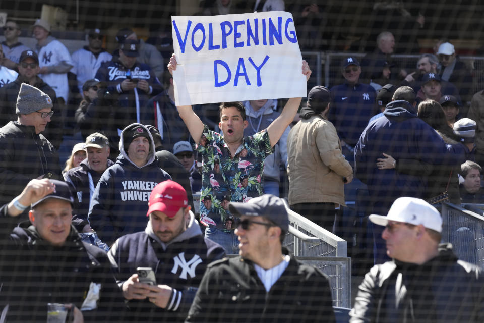 A fan holds up a sign about New York Yankees' Anthony Volpe before the opening day baseball game between the Yankees and San Francisco Giants at Yankee Stadium Thursday, March 30, 2023 in New York. (AP Photo/Seth Wenig)