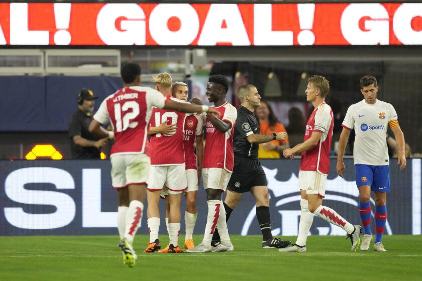 Arsenal FC players celebrate after a goal scored by midfielder Leandro Trossard (19) during the second half of a Champions Cup soccer match against FC Barcelona, Wednesday, July 26, 2023, in Inglewood, Calif. (AP Photo/Ashley Landis)