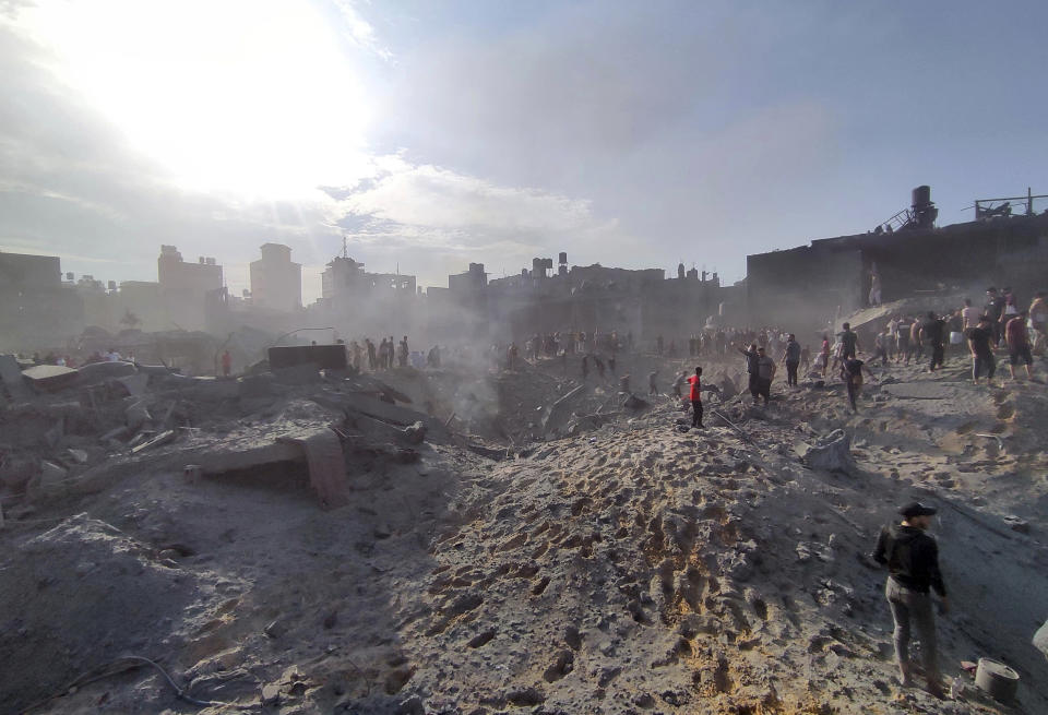 FILE - Palestinians inspect the damage of buildings destroyed by Israeli airstrikes on Jabaliya refugee camp on the outskirts of Gaza City on Oct. 31, 2023. Jabaliya refugee camp was one of Gaza’s most densely populated areas and has been struck multiple times since Oct. 7. The true toll remains unknown because many remain under the rubble. (AP Photo/Abdul Qader Sabbah, File)