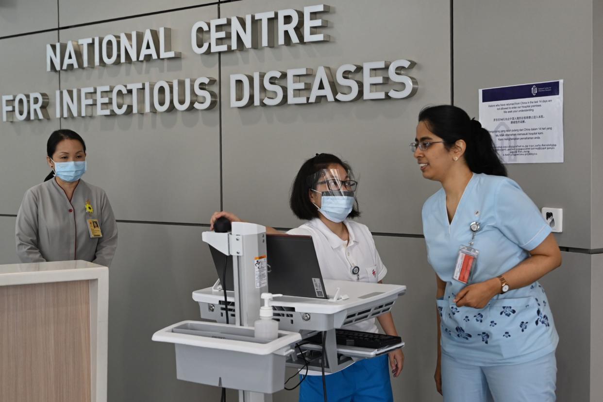 Medical staff prepare pre-screening procedure at the National Centre for Infectious Diseases building at Tan Tock Seng Hospital in Singapore on 31 January, 2020. (PHOTO: AFP via Getty Images)