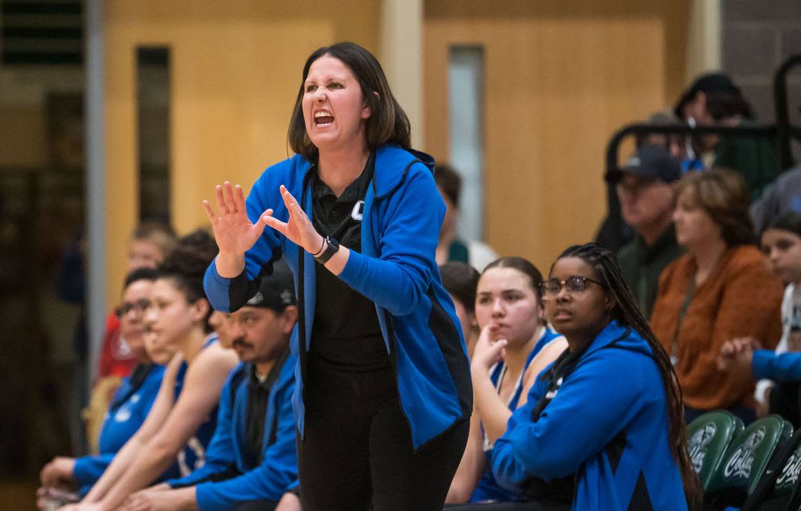 Caruthers Blue Raiders head coach Anna Almeida gestures from the sideline as her girls play the Colfax Falcons during the first quarter of the CIF Northern California Division III high school girls basketball championship game Tuesday, March 7, 2023, at Colfax High School. Colfax beat Caruthers, 53-52, and advances to the state championship game Friday at Golden 1 Center.