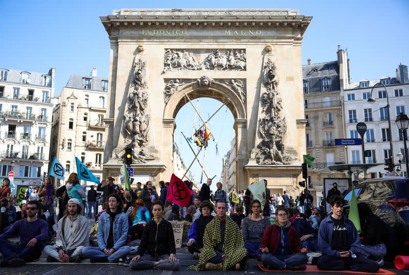 Extinction Rebellion activists hold protest in Paris, urging presidential candidates to act on climate change