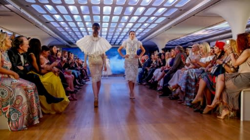 Models walk on the catwalk displaying designs by Amato Couture during Arab Fashion Week in the Gulf emirate of Dubai on May 9, 2018