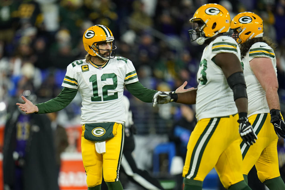 Green Bay Packers quarterback Aaron Rodgers (12) looks to his sideline after a failed pass attempt in the first half of an NFL football game against the Baltimore Ravens, Sunday, Dec. 19, 2021, in Baltimore. (AP Photo/Julio Cortez)