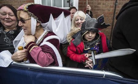 Members of the public wear fancy dress as they gather outside Leicester Cathedral ahead of a service of reinterment for England's King Richard III in Leicester, March 26, 2015. REUTERS/Richard Pohle/Pool