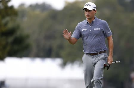 Sep 24, 2017; Atlanta, GA, USA; Kevin Kisner waves to the gallery during the final round of the Tour Championship golf tournament at East Lake Golf Club. Mandatory Credit: Brett Davis-USA TODAY Sports