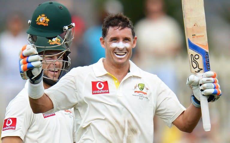 Australia veteran Mike Hussey celebrates his century against Sri Lanka on during the first Test match in Hobart, Tasmania, on December 15, 2012. Hussey has announced he will retire from Test cricket after next week's third and final clash against Sri Lanka in Sydney