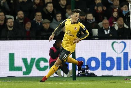 Britain Football Soccer - West Ham United v Arsenal - Premier League - London Stadium - 3/12/16 Arsenal's Mesut Ozil celebrates scoring their first goal Action Images via Reuters / John Sibley Livepic