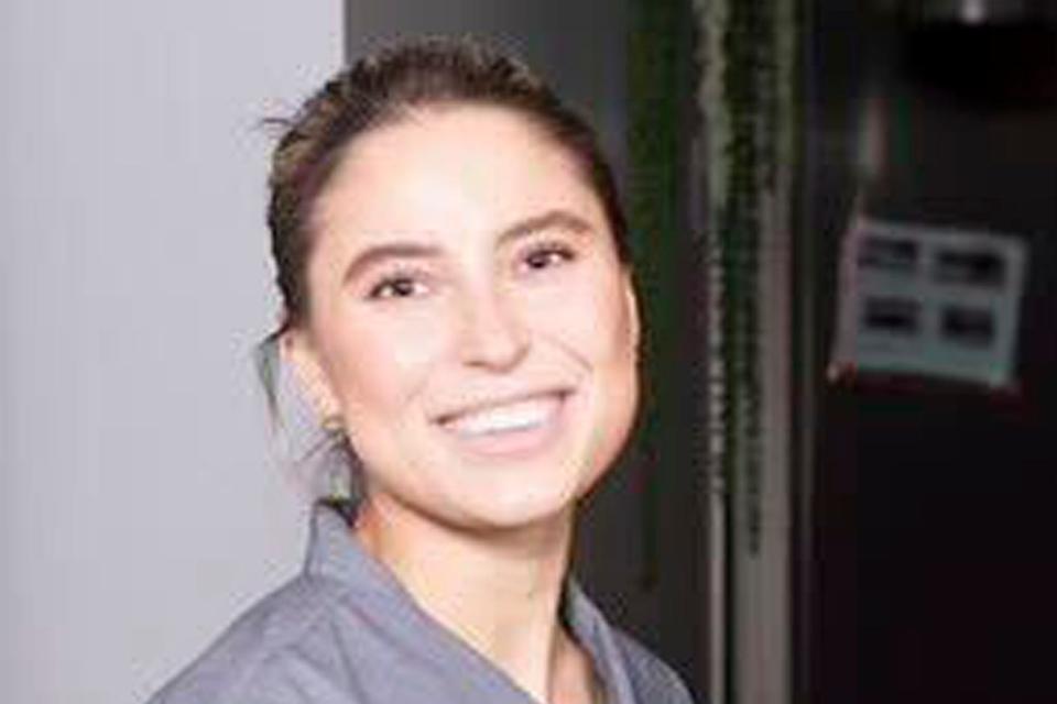 In this undated photo provided by Ksenia Leonteva, Los Angeles-based esthetician Ksenia Khavana is pictured in her medical scrubs. The 33-year-old with dual U.S.-Russian citizenship has been arrested in Russia on suspicion of raising funds for the Ukrainian military.