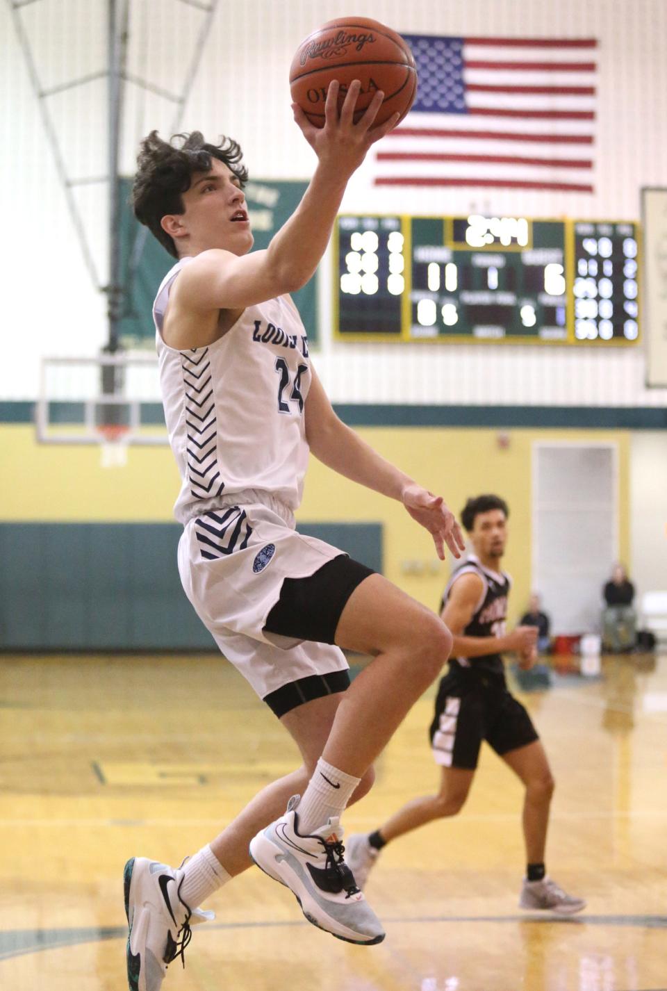 Louisville's Hayden Nigro drives to the hoop vs. Howland in a D2 boys basketball district final at Ashtabula Lakeside; Friday, March 4, 2022.