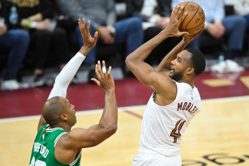 Cavaliers forward Evan Mobley shoots the ball against Celtics center Al Horford in the third quarter of Game 3 of the Eastern Conference semifinals, May 11, 2024, in Cleveland.