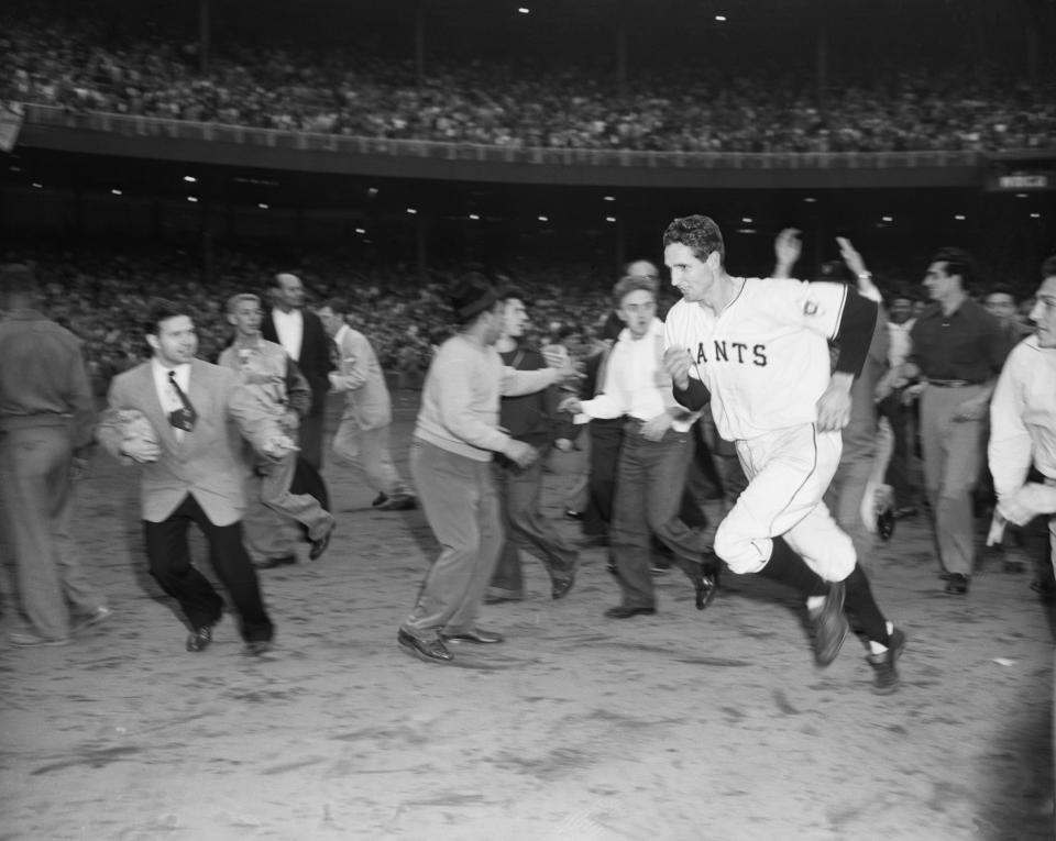 Thomson is surrounded by fans on the field after hitting his homer. (Bettmann Archives/Getty Images)