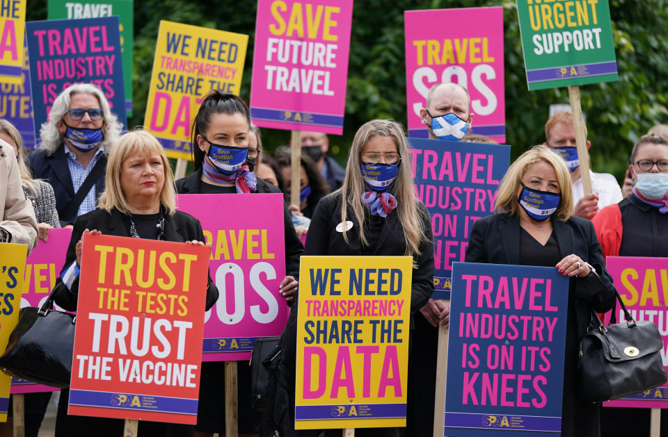 <p>Trade bodies from across the aviation and travel industries outside the Scottish Parliament in Edinburgh, during a Travel Day of Action calling on the UK Government to support a safe return to international travel in time for the peak summer period. Picture date: Wednesday June 23, 2021.</p>
