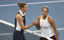 Karolina Pliskova of the Czech Republic, left, shakes hands with Madison Keys of the United States, right, after Pliskova won the match 6-4, 4-6, 7-5, at the Brisbane International tennis tournament in Brisbane, Australia, Sunday, Jan. 12, 2020. (AP Photo/Tertius Pickard)