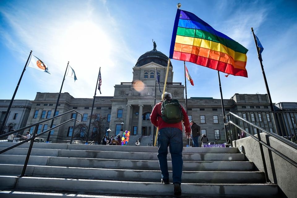 Demonstrators gather on the steps of the Montana State Capitol protesting proposed anti-transgender legislation.