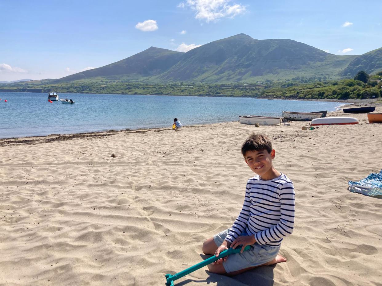 <span>Nazia Parveen’s son enjoys the beach close to Bert’s Kitchen Garden on the Llŷn peninsula.</span><span>Photograph: Nazia Parveen</span>