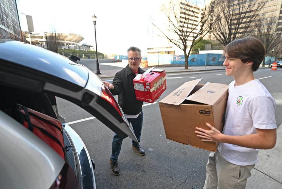 Brendan Kelly has used the help of his two sons — including Liam, at right — to try to address the issue of food insecurity in the Charlotte area. But he may soon be on his own. JEFF SINER/jsiner@charlotteobserver.com