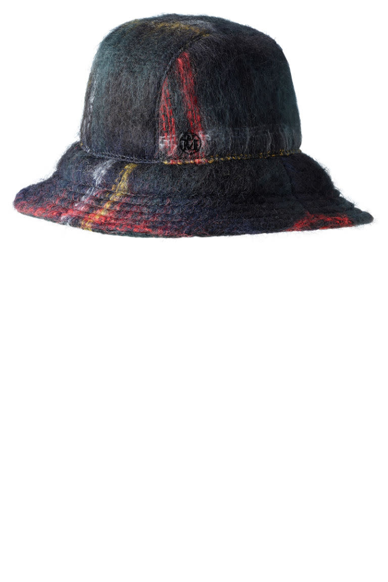 <p><strong>Maison Michel </strong>hat, $441, <a rel="nofollow noopener" href="https://www.michel-paris.com/en/estore/accessories/gemma--bucket-hat--mohair/p/2130002001" target="_blank" data-ylk="slk:michel-paris.com;elm:context_link;itc:0;sec:content-canvas" class="link ">michel-paris.com</a>. </p>