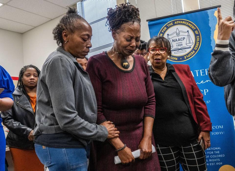 Tere Harris, center, mother of Paso Verde Elementary School teacher Kaylin Footman, who was arrested after a mental health crisis, is comforted by Bobbie Wooten-Feed, left, and Sacramento NAACP President Betty Williams on Monday, Oct. 23, 2023, as they plead for her transfer from Sacramento County’s Main Jail to a medical facility. The Natomas Unified teacher was arrested when police were called to her home.