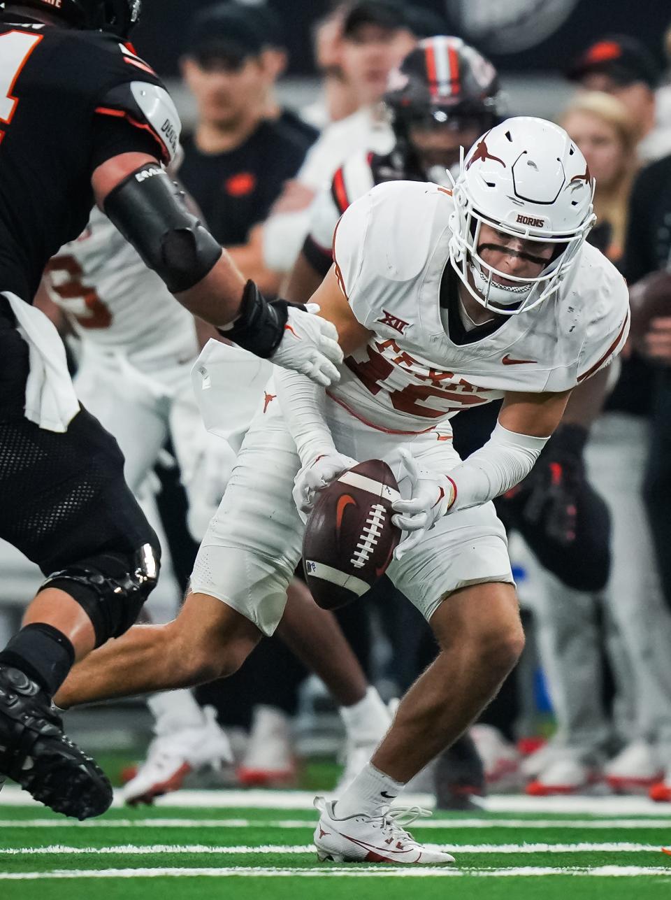 Texas defensive back Michael Taaffe (16) grabs a loose ball by his fingertips to run with it in the third quarter of the Big 12 Conference Championship game at AT&T Stadium in Arlington, Texas, Saturday, Dec. 2, 2023. Texas won the game 49-21 to become 2023 Big 12 Conference Champions.