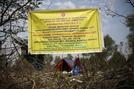 A banner is seen in the Vashan Char, previously known as Thengar Char island in the Bay of Bengal, Bangladesh February 14, 2018. REUTERS/Stringer