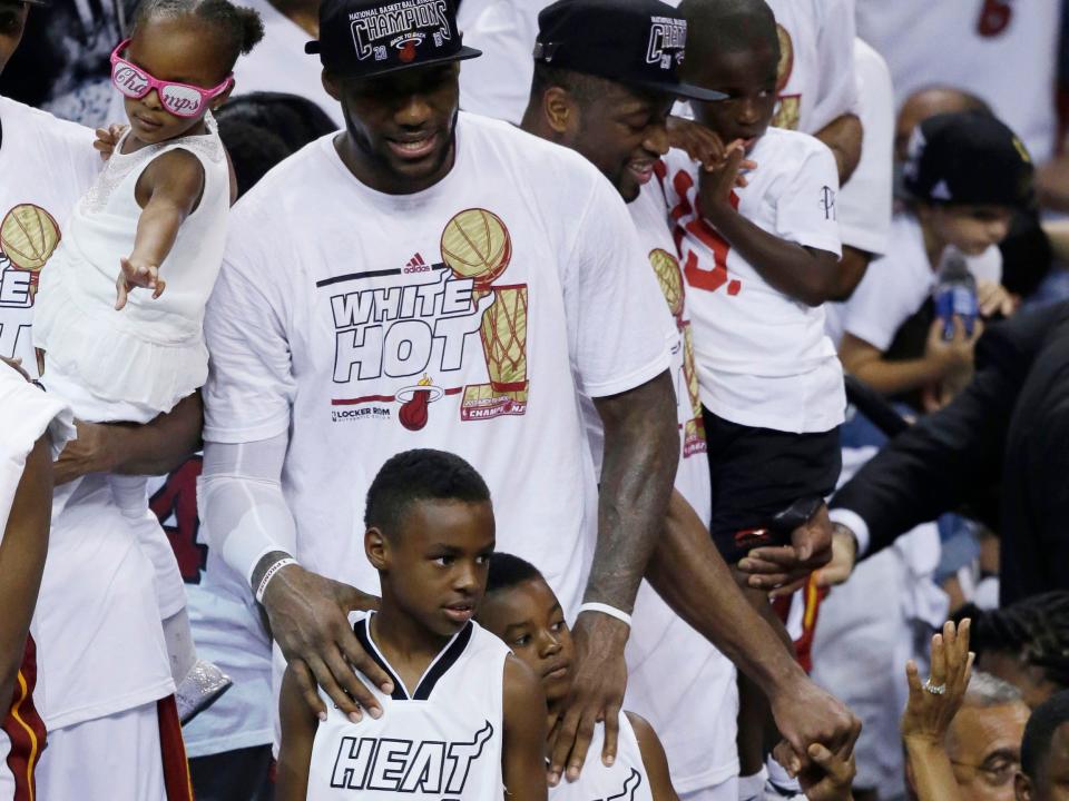 LeBron James celebrates the Miami Heat's 2013 NBA championship with his sons, Bronny (left) and Bryce.