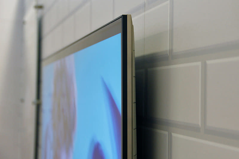 The X94E and X93E's flush mount swivel bracket enables the TVs to go pretty close to the wall.