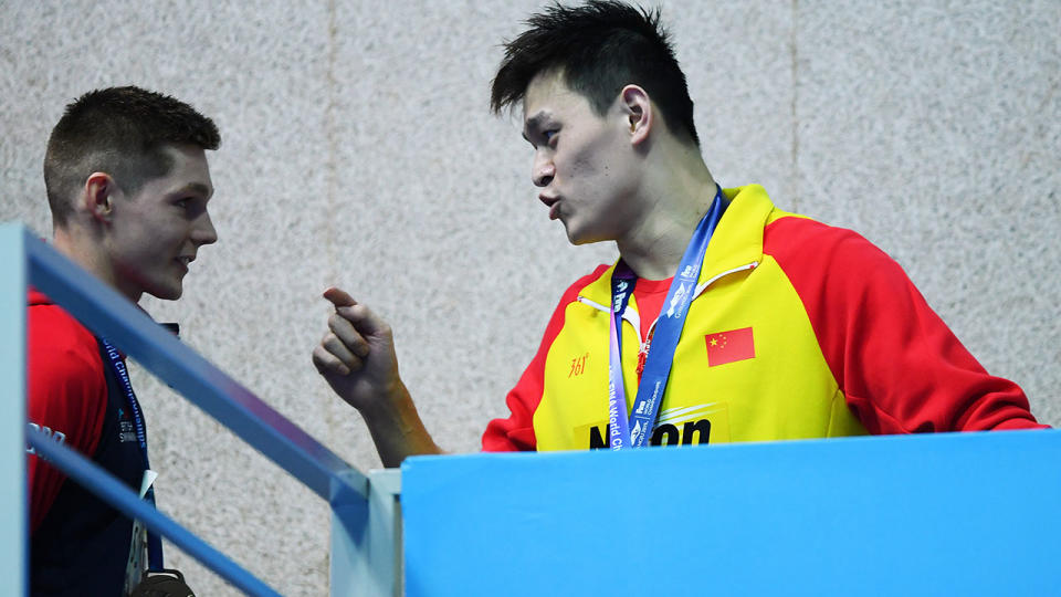 Sun Yang, pictured here clashing with Duncan Scott at the world championships. (Photo by Quinn Rooney/Getty Images)