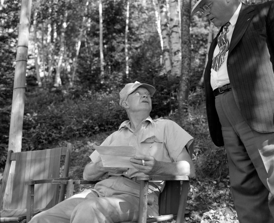 Dwight D. Eisenhower (left), then U.S. Army chief of staff, takes a break while vacationing in Minocqua in July 1946. The future president and his four brothers stayed at the Moody Resort on Big Lake.