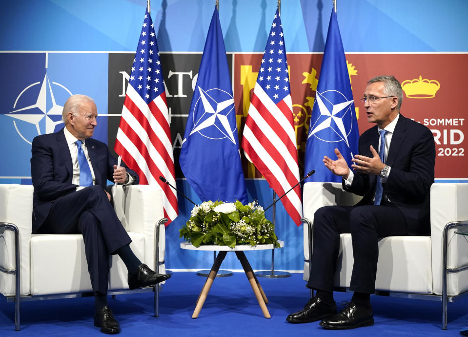 FILE - President Joe Biden, left, speaks with NATO Secretary General Jens Stoltenberg during a meeting at the NATO summit in Madrid, Spain on June 29, 2022. Biden is welcoming outgoing NATO Secretary-General Jens Stoltenberg to the White House on Monday, June 12, 2023, as the competition to find his successor to lead the military alliance heats up. Stoltenberg, who has led NATO since 2014 indicated earlier this year he would move on when his term expires at the end of September. (AP Photo/Susan Walsh, File)