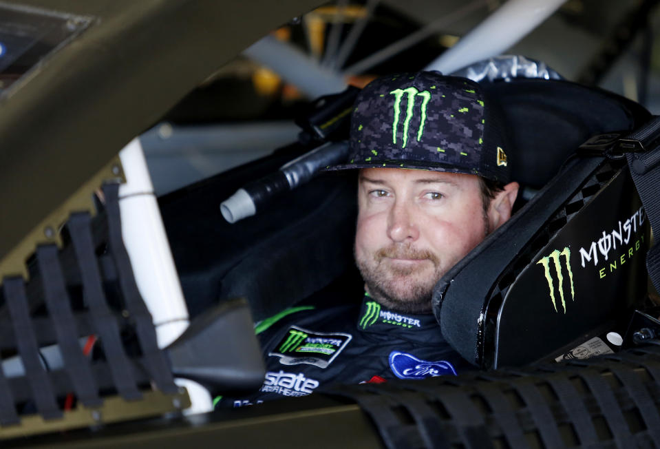FILE – In this July 20, 2018, file photo, Kurt Busch waits in his car before NASCAR Cup Series auto racing practice at New Hampshire Motor Speedway in Loudon, N.H. NASCAR’s driver carousel will spin long after the season finale. Former Cup champions Busch and Matt Kenseth, and Daniel Suarez, AJ Allmendinger, Regan Smith and Jamie McMurray are among the drivers certain to start next season with new teams or new roles. (AP Photo/Mary Schwalm, File)