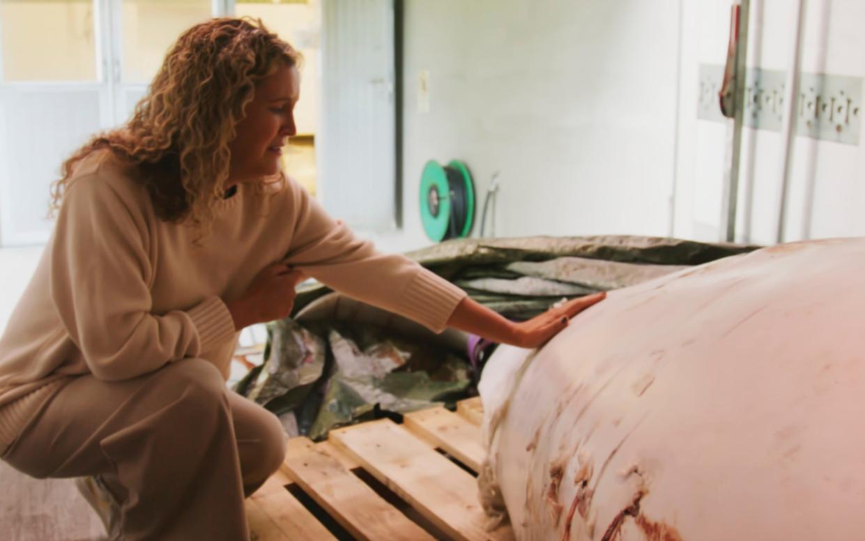 One Whale manager Regina Haug with the carcass of Hvaldimir