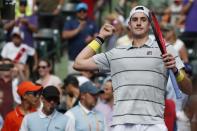 Mar 28, 2018; Key Biscayne, FL, USA; John Isner of the United States celebrates after his match against Hyeon Chung of Korea (not pictured) on day nine at the Miami Open at Tennis Center at Crandon Park. Isner won 6-1. 6-4. Mandatory Credit: Geoff Burke-USA TODAY Sports