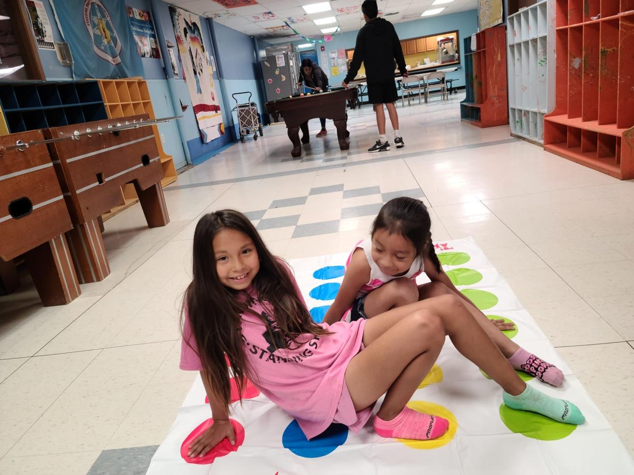 Two children play a game at the Boys & Girls Club of Standing Rock in McLaughlin. The club provides a safe place for children to hang out but also to get healthy meals during the summer.