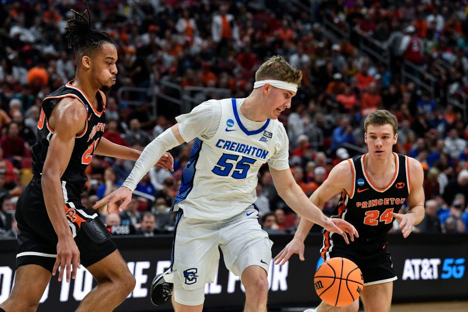 Creighton guard Baylor Scheierman (55) moves the ball against Princeton guard Blake Peters (24) in the first half of a Sweet 16 round college basketball game in the South Regional of the NCAA Tournament, Friday, March 24, 2023, in Louisville, Ky. (AP Photo/Timothy D. Easley)