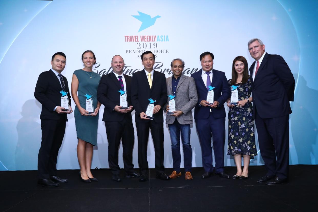 Winners of the Airline category awards pose alongside Robert Sullivan (first from right), president of Northstar Travel Group. (PHOTO: Travel Weekly Asia)