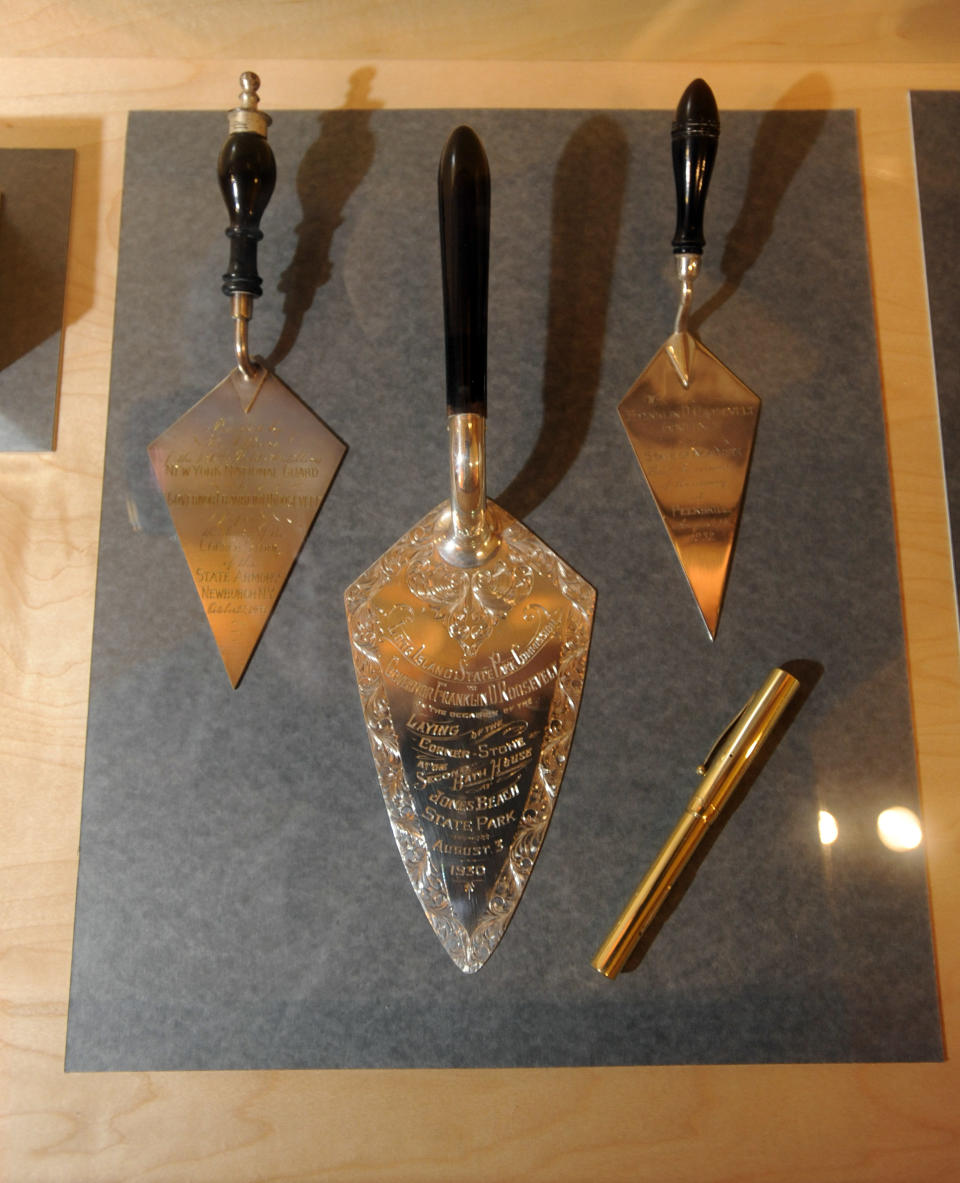 In this July 31, 2012 photo, commemorative trowels used by Franklin Roosevelt at groundbreaking ceremonies sit on display at the Capitol in Albany, N.Y. Historic artifacts that have been kept in storage for years are now on display in the corridors of the Capitol and the adjacent Empire State Plaza. (AP Photo/Tim Roske)