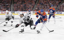 Los Angeles Kings' Drew Doughty (8) tries to stop Edmonton Oilers' Leon Draisaitl (29) during the second period of Game 2 in an NHL hockey Stanley Cup first-round playoff series Wednesday, April 19, 2023, in Edmonton, Alberta. (Jason Franson/The Canadian Press via AP)