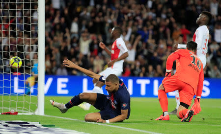 Soccer Football - Ligue 1 - Paris St Germain v AS Monaco - Parc des Princes, Paris, France - April 21, 2019 Paris St Germain's Kylian Mbappe scores their first goal REUTERS/Gonzalo Fuentes