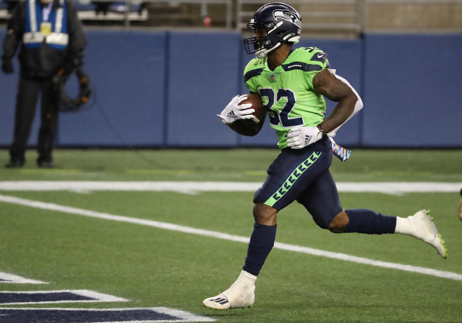 Seattle Seahawks running back Chris Carson gestures while smiling after an  NFL football game against the Dallas Cowboys, Sunday, Sept. 27, 2020, in  Seattle. The Seahawks won 38-31. (AP Photo/Stephen Brashear Stock